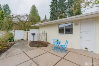 Courtyard entry feels private and can be a restful place with blooming fig tree.