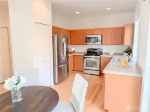 The kitchen boasts lots of storage space, including a pantry