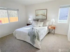 Primary suite includes its own bathroom and a walk-in closet