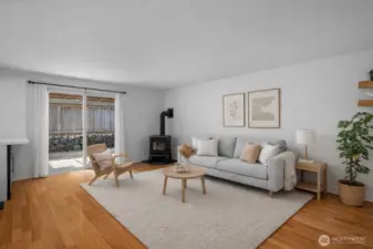 The virtually staged family room offers the perfect place to unwind at day’s end or enjoy relaxed weekend downtime. Freestanding gas stove adds warmth and ambiance.