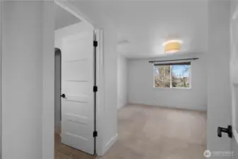 Walk-in closet space in primary suite.