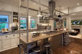 Stainless steel, slab stone, Bluestar, Sub Zero, Waterworks, Miele, Gaggenau and more, mingle in the kitchen made for at home cooks and caterers to love.