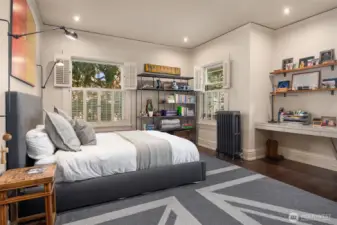 Southeast bedroom with walk in closet, built in desk and lake view.