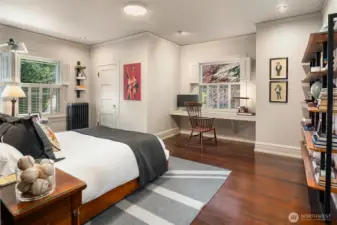 Northeast bedroom with walk in closet and built in desk.