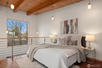 Spaces can be flexible. This could be an office, and downstairs could be used as your primary. Both can fit a Queen/King bed.