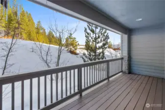 Private deck off of the living room is the perfect spot for your morning coffee.
