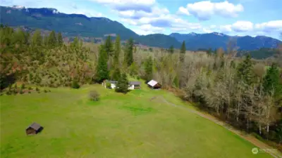 Escape to the serene countryside of Randle, WA, where a charming single-wide manufactured home awaits on a scenic 6.64-acre lot...