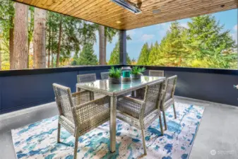 The covered outdoor living space with nice lake and mountain views is perfectly located just off the family room and offers built in speakers and an overhead heater!