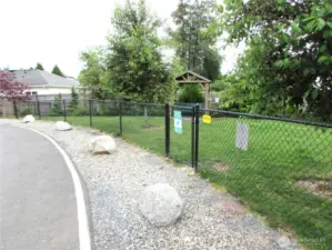 COMMUNITY MEMBERS ENJOY THIS NEW ENCLOSED DOG PARK, JUST STEPS AWAY.