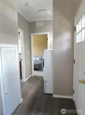 PRIMARY BEDROOM AT END OF HALL, BACK DOOR ON RIGHT. AND OTHER BATHROOM ON LEFT.