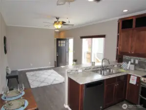 LIVING ROOM WINDOWS FACE SOUTH AND HEAT PUMP TO KEEP YOU COOL.