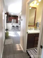 FRONT DOOR ON LEFT AND MAIN BATH ON RIGHT.
