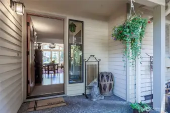 A welcoming front porch invites you to relax and take in the peaceful surroundings.