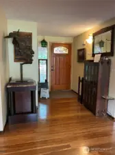 A spacious entry way with bamboo floors and coat closet