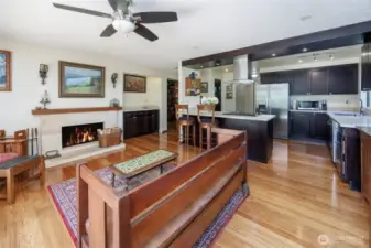 A wonderful gathering space, open to kitchen, wet bar, fireplace and to the newly built wood deck and private backyard.