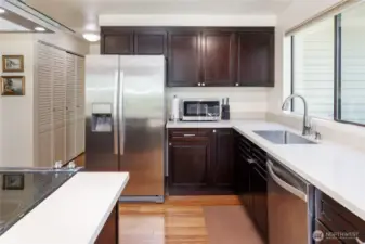 Updated kitchen is a chef's delight with bamboo floors, stainless appliances, quartz counter tops and huge pantry.