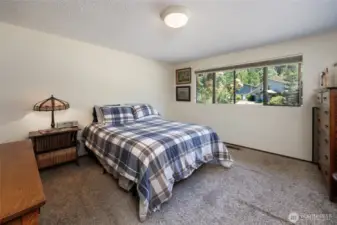 Primary suite has updated 3/4 bath and cedar lined walk in closet.