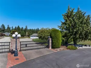 Double gated.  Gate at the entrance of the community and a gate at the residence.