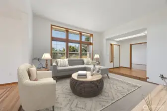 Huge picture windows in the living room. Virtually staged