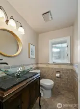 Half bathroom for guests off the front entry