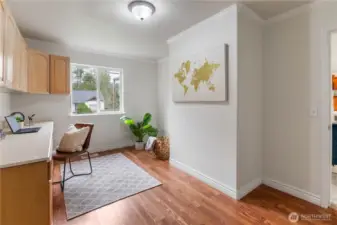It would be very easy to add a closet where the plant and basket are, should you like to use this room as a 4th bedroom. Otherwise, it makes a delightful office, play room, or craft room.