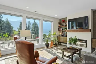 Great room with access to fireplace, television and amazing views of the River and Mountains!