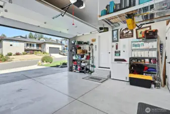 Spacious garage with amazing storage racks added to fit all of your belongings and toys.