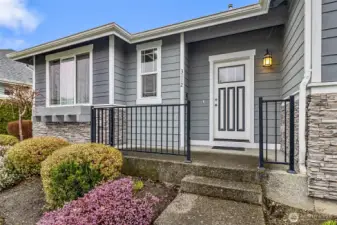 Big front porch with railings to welcome your guests