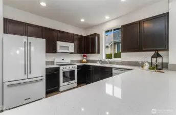 Fantastic cabinet space throughout with white appliances, extra large refrigerator