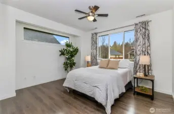 The main suite with a great amount of natural light