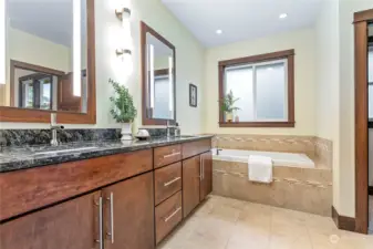 To right of tub is separate commode room