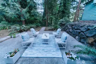 lower level patio offering entertaining delights surrounded by greenery and trails