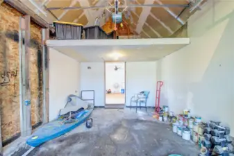 Garage interior with loft storage.