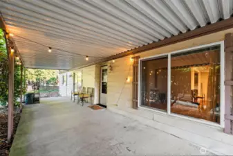 Covered patio entrance on left side of home.