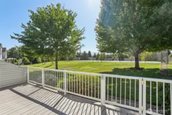 Rear Deck overlooks Pickle Ball Court and beautifully kept common areas.