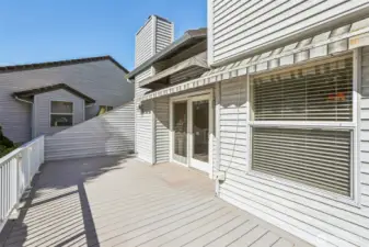 Rear back patio with Custom SunSetter retractble shade cover. (west/southwest facing) so this gets LOTS of summer sun!