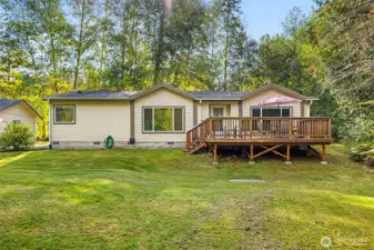 Front of house, block foundation, large deck