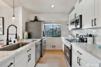 Fully equipped kitchen with ample storage for the chef.