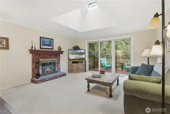 Open living room with gorgeous skylights letting in tons of natural light!