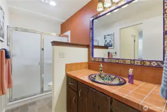 Gorgeous remodeled primary bath with a SW flair.
