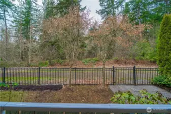 Scenic greenspace is the backdrop, fresh mulch in garden beds is ready for your Spring planting! Fully fenced and ready for your four-legged friend!