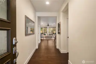 Gleaming Engineered hardwoods welcome you into this generous entryway and draw your eye out to the beautiful permanent greenbelt!
