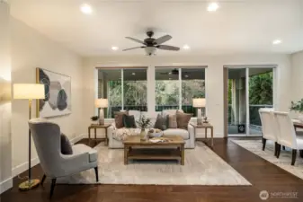 Oversized windows allow light to stream in on the Southern facing lot.  Beautiful millwork, fresh interior paint, gleaming Engineered hardwoods and generous open floorplan that lives large!