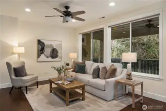 The oversized great room with scenic views.  Wrapped windows, upgraded trim and custom window coverings throughout.