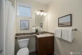 Guest bath with Quartz counter and undermount sink.