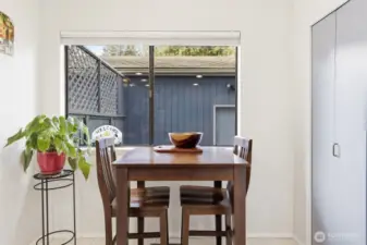 Eat in kitchen space looking onto private front courtyard patio.