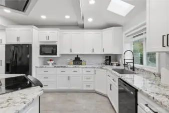 Light-filled kitchen with skylights and expansive counter space