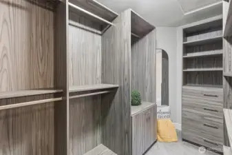 Large walk-in closet with custom built-in organization system