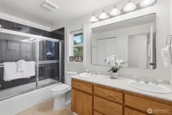 Updated bathroom with double vanity and ample storage