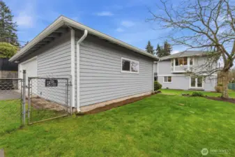 Detached garage with additional storage and workspace